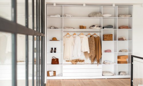 Modern interior, beautiful wardrobe with clothes
